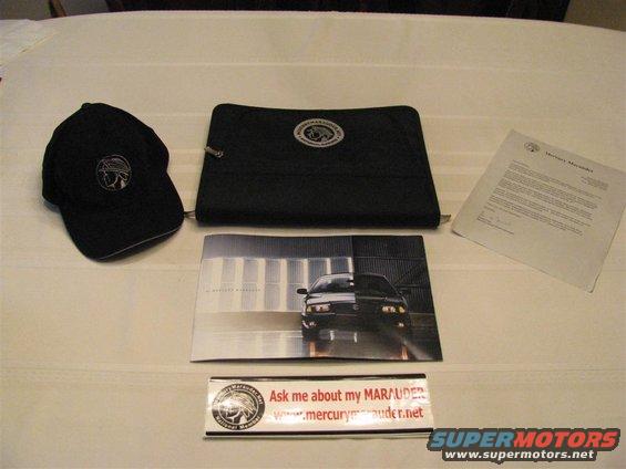 img_5053-(large).jpg Marauder hat, MM.net binder, 2003 brochure, and MM.net bumper sticker.