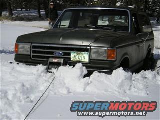 1987 Ford Bronco in snow with winch