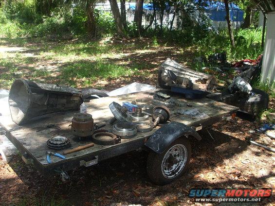 trans1.jpg 2 E4ODs, one torn down, other ready to tear down for parts........the one torn down will be the one i rebuild since it only has burnt clutches