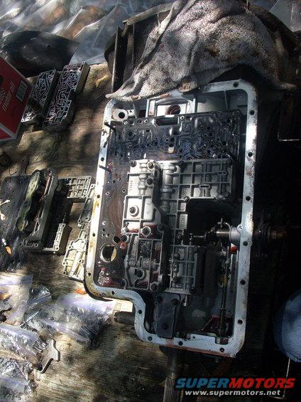 trans9.jpg next is the main valve body, followed by the 3 bolts retaining the seperator plate