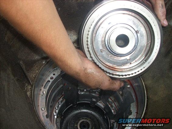 trans30.jpg after this step you will remove the sun shell, then reverse clutchs and reverse planetary........this parts trans was being harvested for the forward and direct clutches, and since the reverse planet exploded i wasnt able to get to the reverse part of the trans.........

if you need to get to the reverse clutches and planetary, there is a great write-up on thedieselgarage.com


this pic is the last of the trans pics because i found out the hard way brake cleaner eats plastic cameras