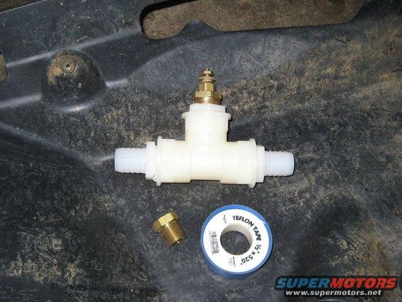 Plastic T-fitting with brass valve and Teflon tape