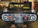 1992 Ford Mustang - Front view of a 1974 Ford Bronco undergoing a build, a prominent winch and roll cage.