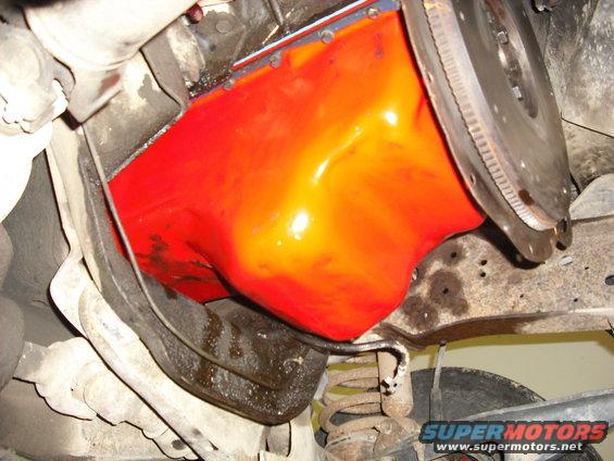 trans-swap-021.jpg I didnt have the time to clean and paint the original oilpan so i used one from another 302 motor I had laying around. Its actually red the flash makes it look orange