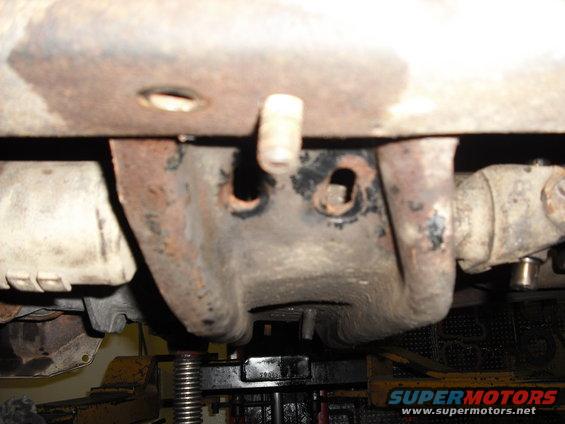 to make up for the extra length the crossmember goes back into the existing holes behind where it was, the new support brackets go into the original locations and the bottoms are moved back for this reason