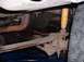 1983 Ford Bronco - Close-up view of the rear axle and suspension system of an unidentified vehicle.