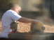 2005 Ford Mustang - A man and a child are seen with a chop saw in an outdoor setting.