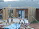 2005 Ford Mustang - A construction site shows a miter saw, ladders, and building materials, indicating ongoing home renovation.