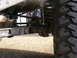 1972 Ford Bronco - Undercarriage view showing the rear axle, shock absorber, and tire tread.