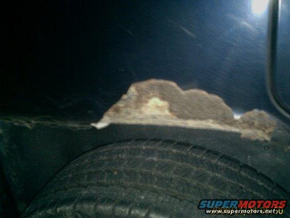 Rust forming on the inner fender above the tire