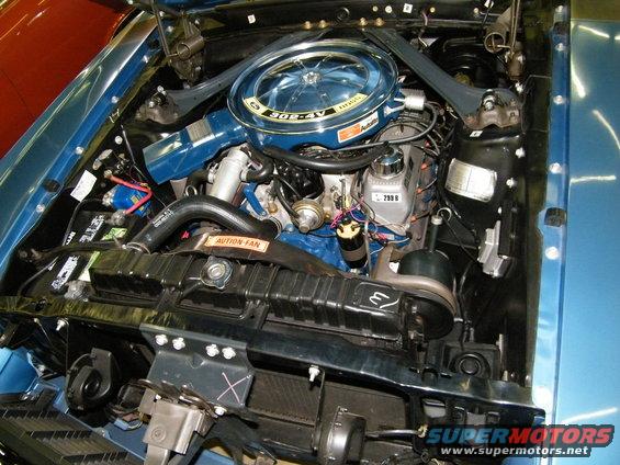 Blue engine bay with a 302-4V air cleaner and a 290B brake fluid reservoir