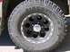 1989 Chevrolet Blazer - A close-up view of a vehicle's tire and wheel assembly, prominent tire brand text.