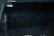 1990 Chevrolet Suburban - A dark, snowy landscape is visible through a frosted windshield, suggesting a winter drive.