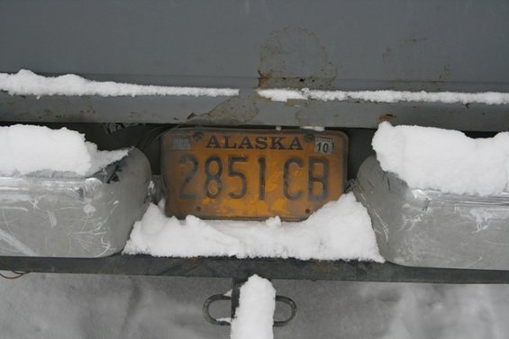 Alaska license plate 2851 CB on a vehicle in the snow