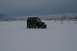 1990 Chevrolet Suburban - Jeep Wrangler navigating a snowy landscape under a cloudy sky.
