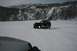 1990 Chevrolet Suburban - A Jeep Wrangler navigates a snow-covered landscape, with a second vehicle in the foreground.