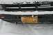 1990 Chevrolet Suburban - Front view of a Toyota truck's grille and license plate, partially covered in snow.