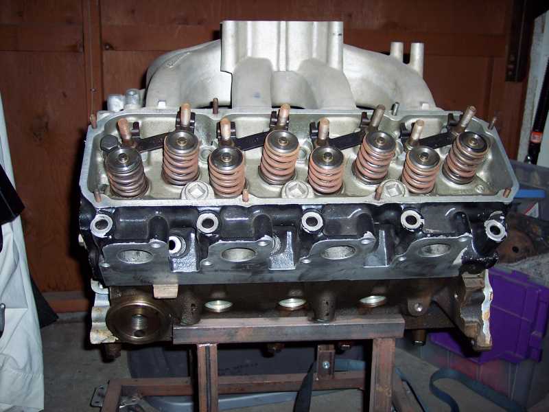 Engine intake manifold and cylinder head assembly on stand