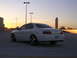 2003 Acura TL - A white 2003 Acura TL is parked in a lot during sunset, showing its rear profile.