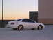 2003 Acura TL - A white sedan is parked in a lot with a building and sunset in the background.