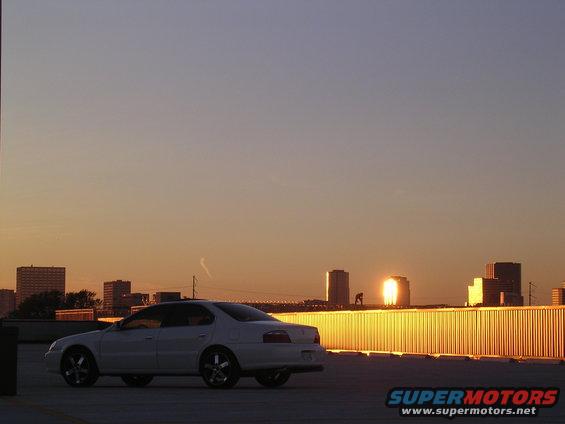 White 2003 Acura TL parked on rooftop during sunset