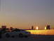 2003 Acura TL - A white 2003 Acura TL is parked on a rooftop overlooking a city skyline at sunset.