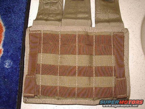 Tan and brown tactical vest with MOLLE webbing
