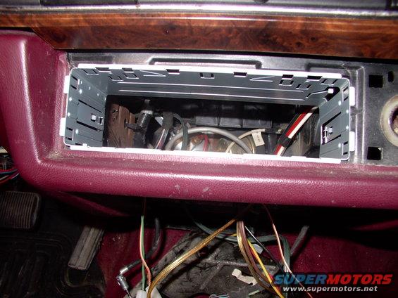 img_0253.jpg Yes, the stock opening is a PERFECT fit for a DIN head unit, requiring NO adapter of any sort.