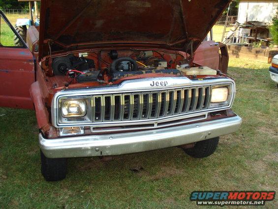 1984 Jeep J-10 front view with hood open, showing engine and grille