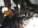 1994 Jeep Cherokee - Close-up view of the front suspension and steering linkage, showing various mechanical parts.