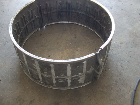 metal cylinder with internal bracing and white markings