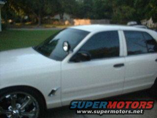 White 1999 Ford Crown Victoria with tinted windows and aftermarket rims