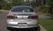 1998 Ford Taurus - Rear view of a silver 1998 Ford Taurus sedan parked on a paved surface.