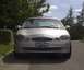 1998 Ford Taurus - A silver 1998 Ford Taurus is shown from the front, parked on a residential street.