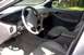 1998 Ford Taurus - The interior of a 1998 Ford Taurus, tan upholstery and dashboard details.