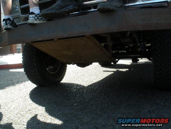 Undercarriage of a truck with diamond plate metal and large tires