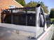 1998 Dodge 3500 - This truck features a custom rack, winch, and a large exhaust pipe in the bed.