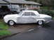 1964 Ford Fairlane - Side view of a silver 1964 Ford Fairlane convertible coupe, appearing to be in primer or unfinished paint.