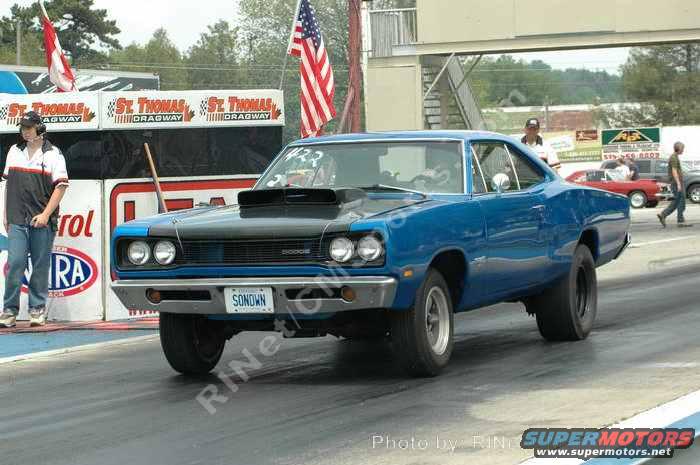 blue 1969 Dodge Coronet drag car on track, hood scoop, drag slicks