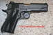 2007 Nissan Titan - Colt Combat Commander pistol shown on a speckled countertop.