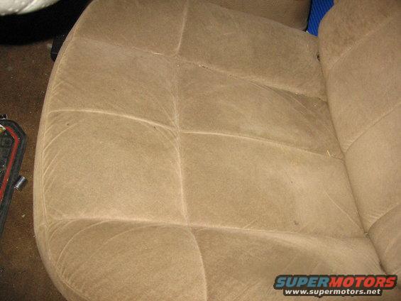 Tan fabric seat interior with visible stitching patterns
