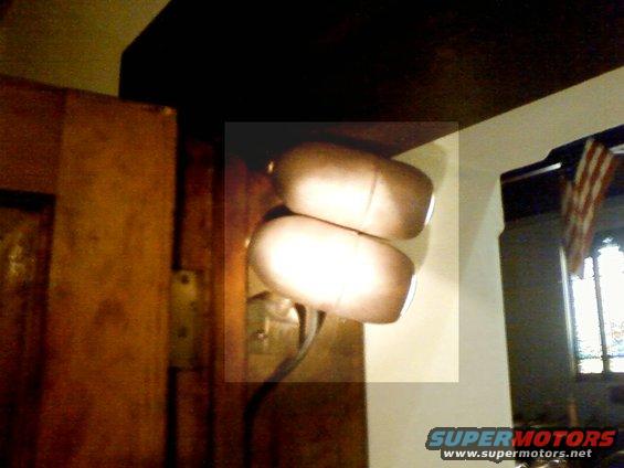 two large round lights mounted on a curved stalk