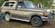 1988 Ford Bronco - This 1988 Ford Bronco features a two-tone paint scheme and a prominent brush guard on the front bumper.