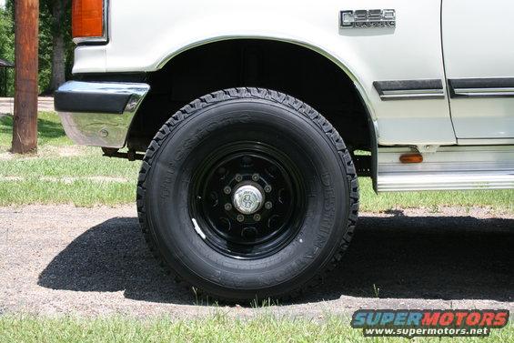 White 1991 Ford C-350 (Centurion Conversions) front wheel and fender with C350 badge