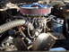 1972 Ford Ranchero - Close-up view of a vehicle's engine bay, an aftermarket air cleaner and cooling fan.