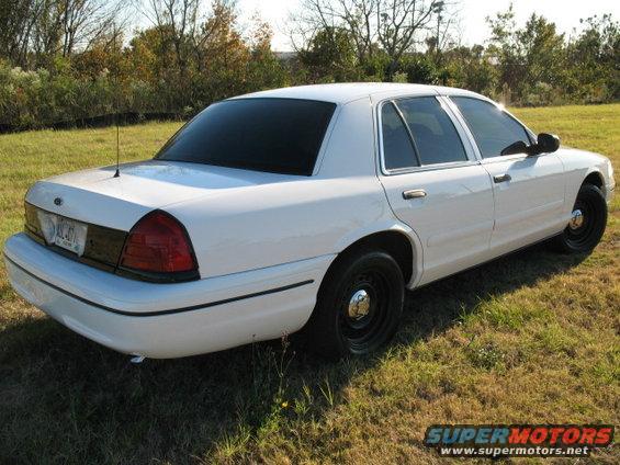 White 2000 Ford Crown Victoria, rear 3/4 view