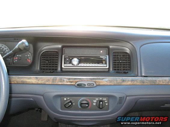 2000 Ford Crown Victoria interior dashboard with JVC stereo and wood trim