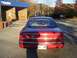 1994 Ford Crown Victoria - Rear view of a red 1994 Ford Crown Victoria at a car wash.