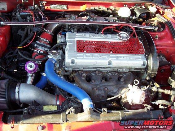 1991 Mitsubishi Eclipse engine bay with aftermarket turbo components