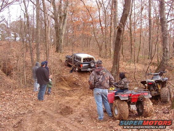 coyo777a.jpg After a few hours digging with the tractor & a few shovels, we got the first pipe buried & ~6" of dirt on it.  I took my truck across & back on the skinny highway tires without much trouble, but the next truck (on A/Ts) didn't make it.